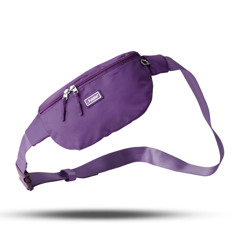 Foldie fuchsia crossbody travel bag with adjustable strap